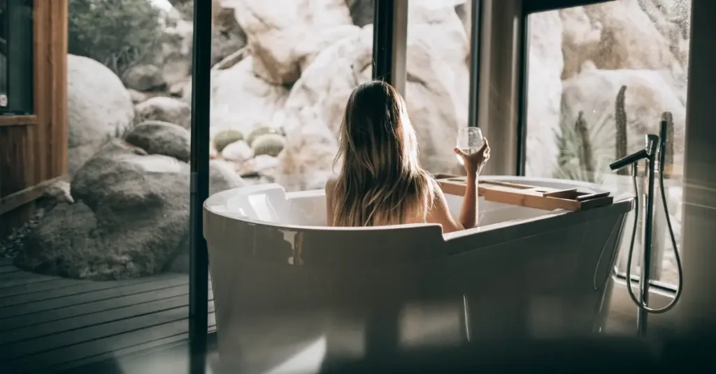woman in light feminine energy in bathtub
