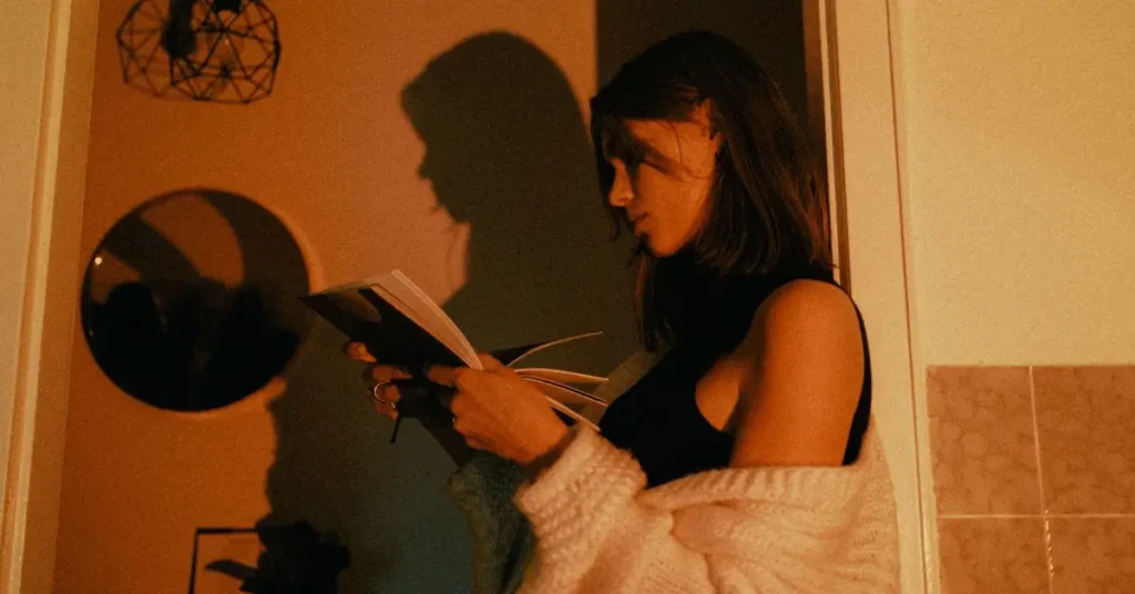 woman reading dark feminine energy book